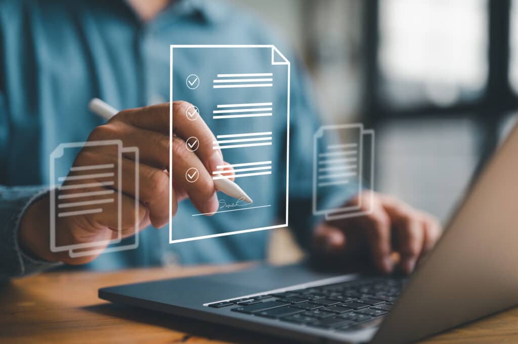 E-document management Paperless workplace, e-signing, electronic signature, document management man signs an electronic document on digital document by virtual notebook screen using a stylus pen.