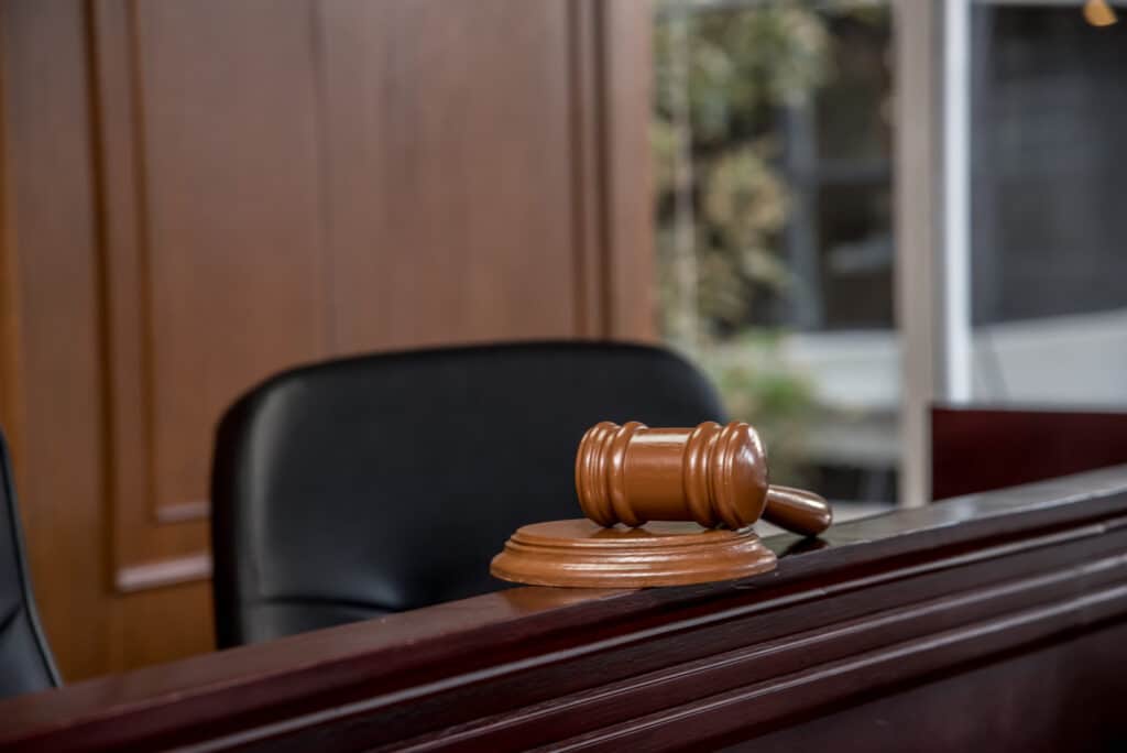 Courtroom scene with a wooden gavel, illustrating legal proceedings and the justice system.